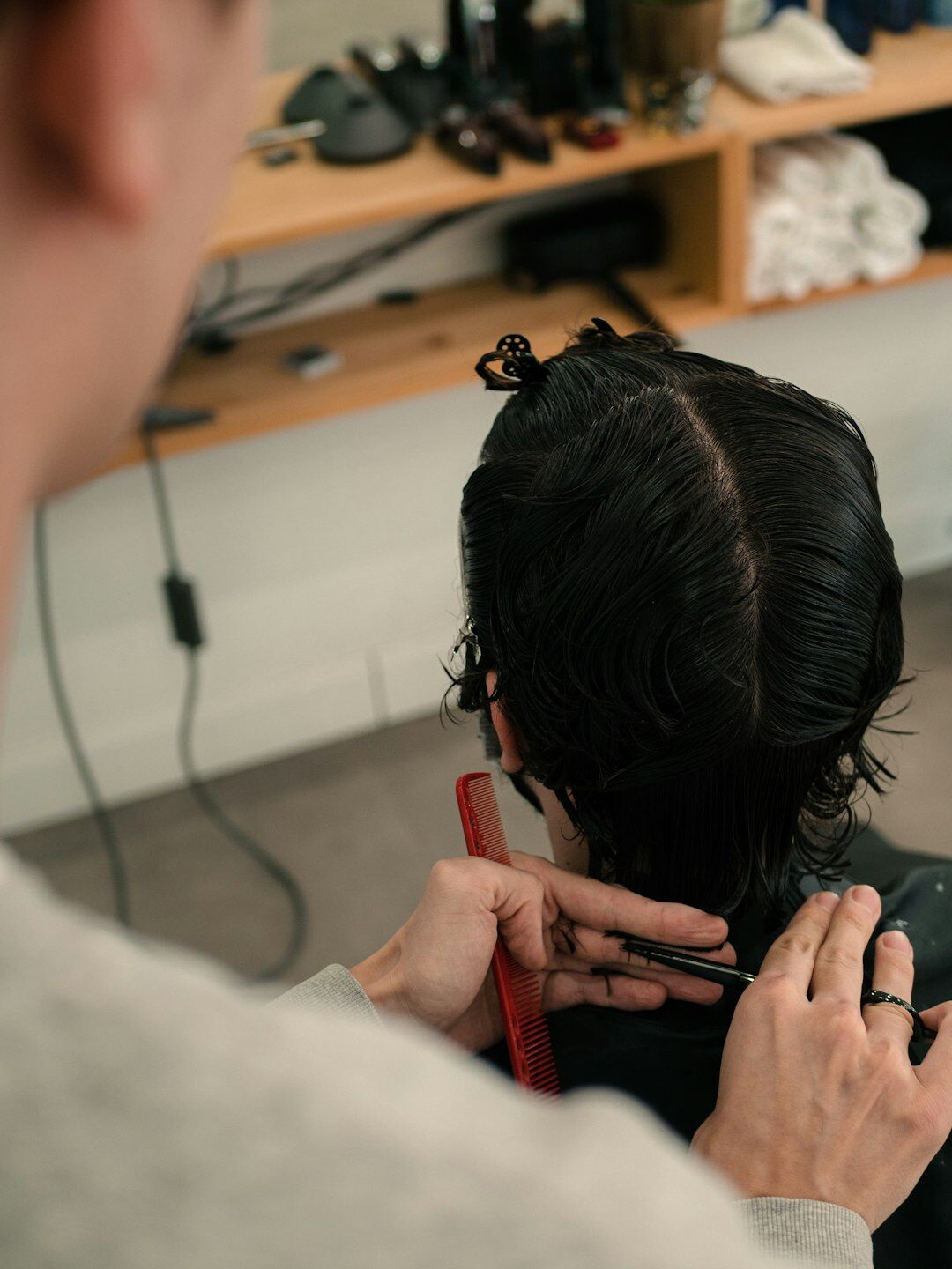 hair stylist cutting bob